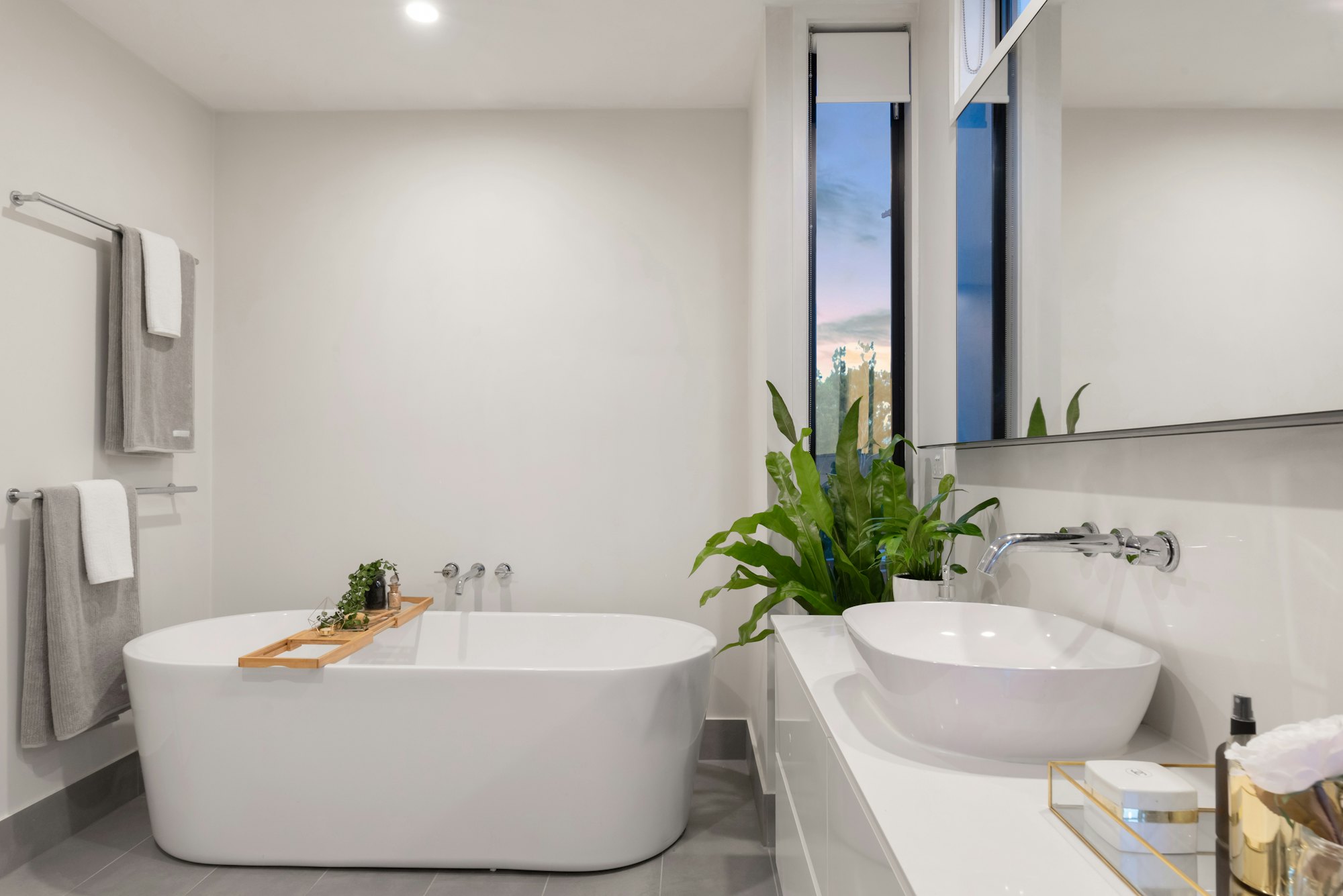 A custom bathroom vanity with wood cabinetry