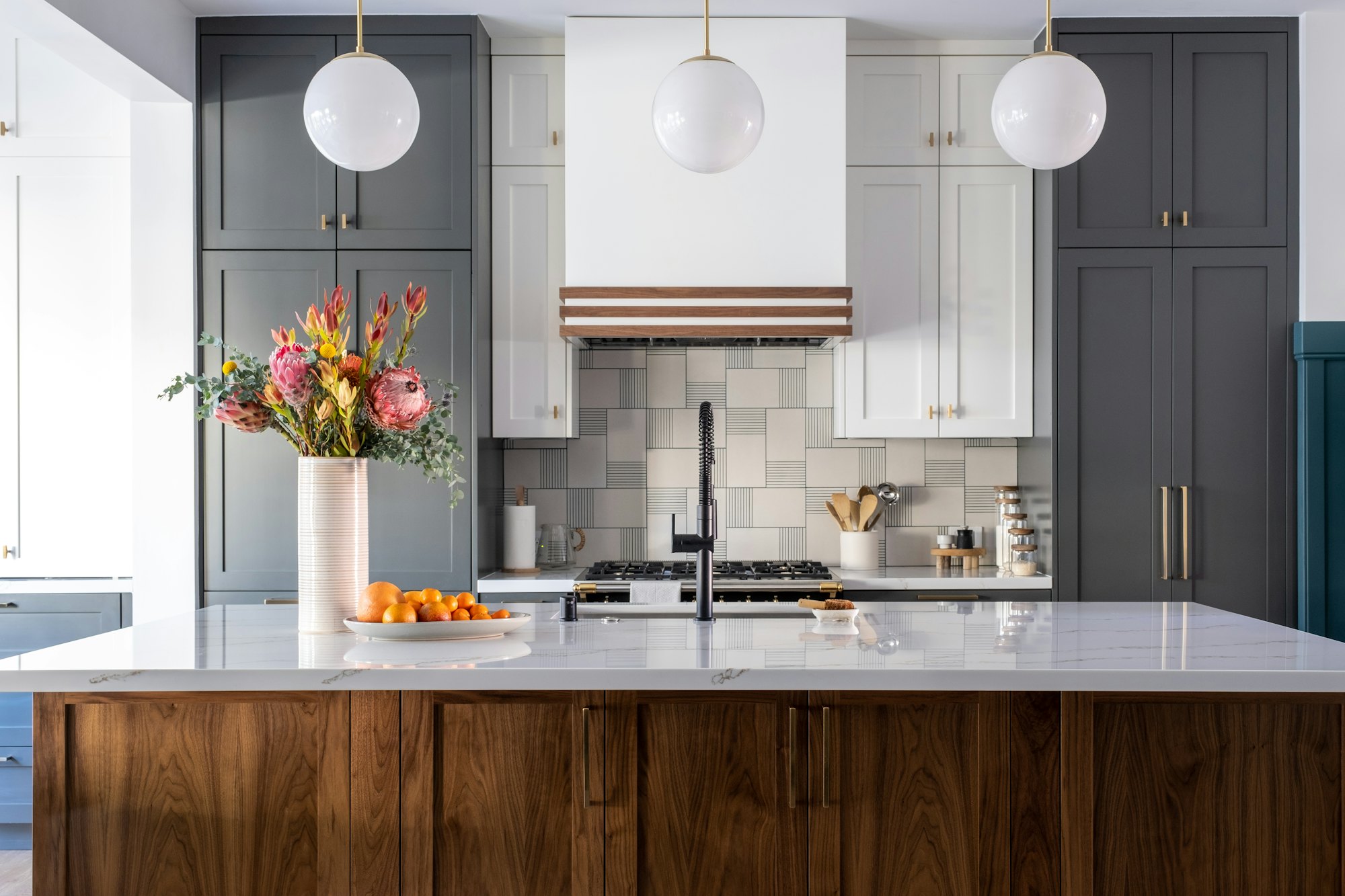 A finished custom kitchen with warm wood cabinetry