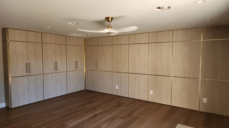 Paneled Wall Clothing Storage with Hidden Closet